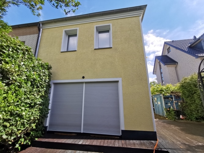 Nachher: Einfamilienhaus Putzfassade vor und nach Reinigung